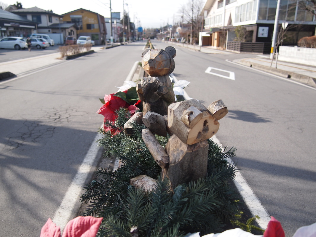 Wooden bears decoration extents along the center zone of Route 18 near the Karizawa Station on Dec 24, 2015